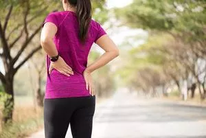 Woman with lower back pain. 